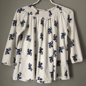 White longer sleeve shirt with blue flowers